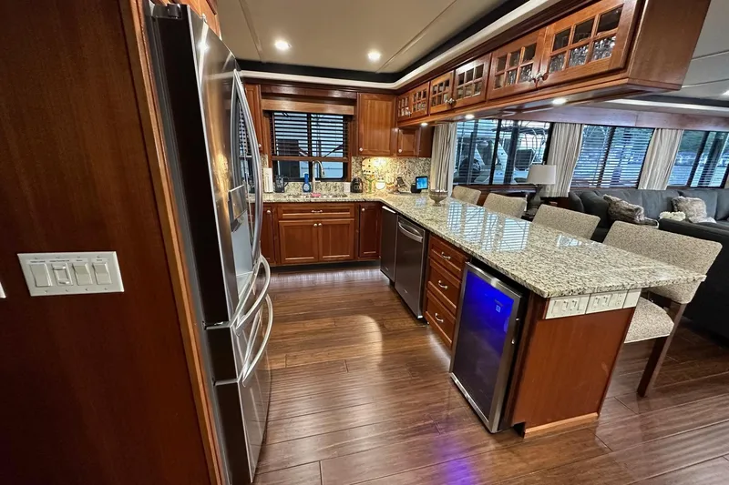 Slide: The Image of Luxurious 2022 Trifecta houseboat kitchen with granite countertops and modern appliances. - 20
