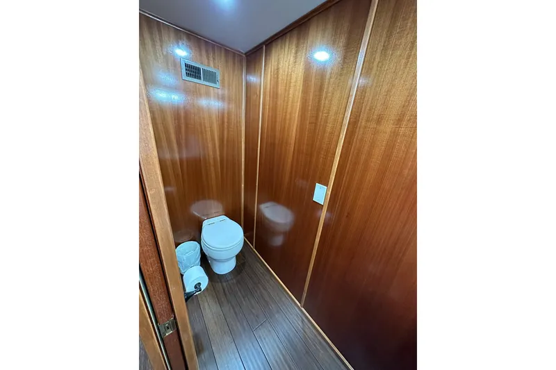 Slide: The Image of Modern Trifecta 2022 houseboat bathroom with wooden walls and flooring. - 28