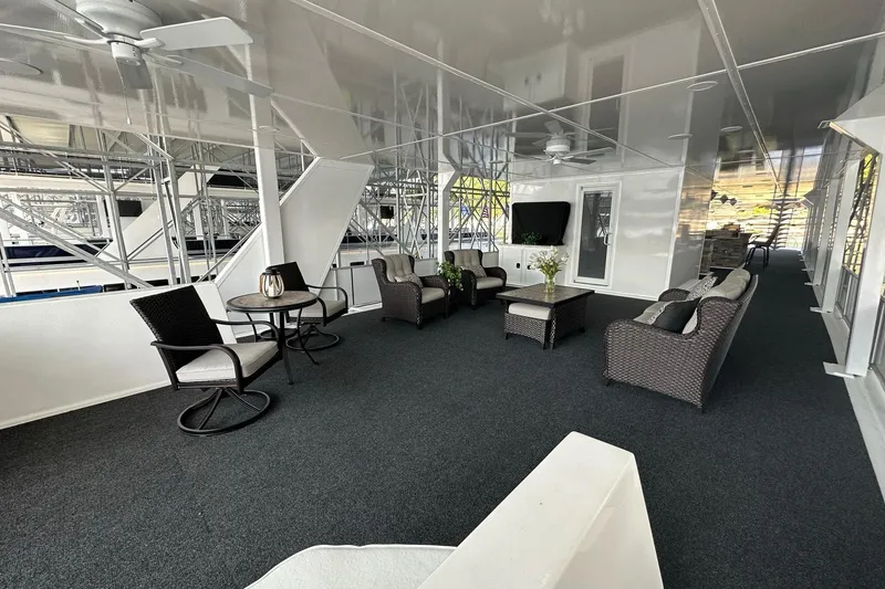 Slide: The Image of Luxurious 2022 Trifecta houseboat interior with modern seating and elegant decor. - 48