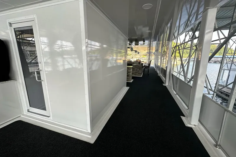 Slide: The Image of Modern 2022 Trifecta houseboat interior with sleek design and spacious walkway. - 50