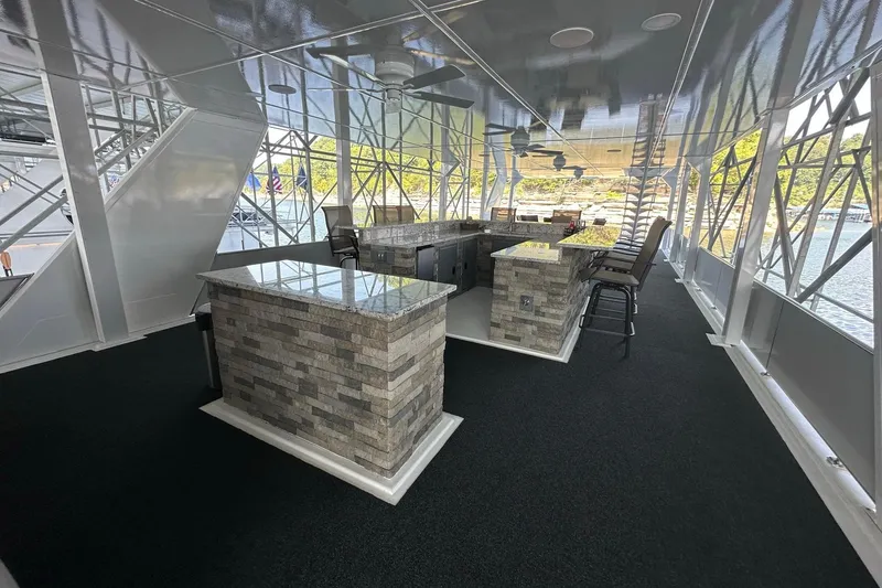 Slide: The Image of Luxurious 2022 Trifecta houseboat interior with modern kitchen and scenic water views. - 52