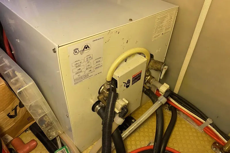 Slide: The Image of Engine room of 2004 Larson Cabrio 330 with mechanical components and wiring. - 10