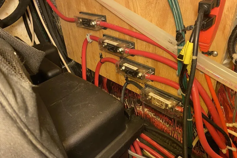 Slide: The Image of Electrical wiring and fuses inside a 2004 Larson Cabrio 330 boat. - 12