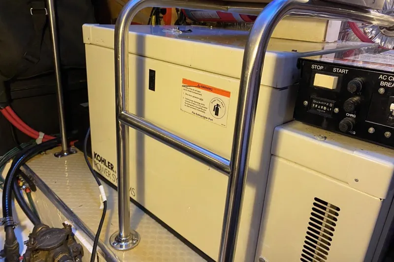 Slide: The Image of Engine room of 2004 Larson Cabrio 330 with Kohler power system. - 13