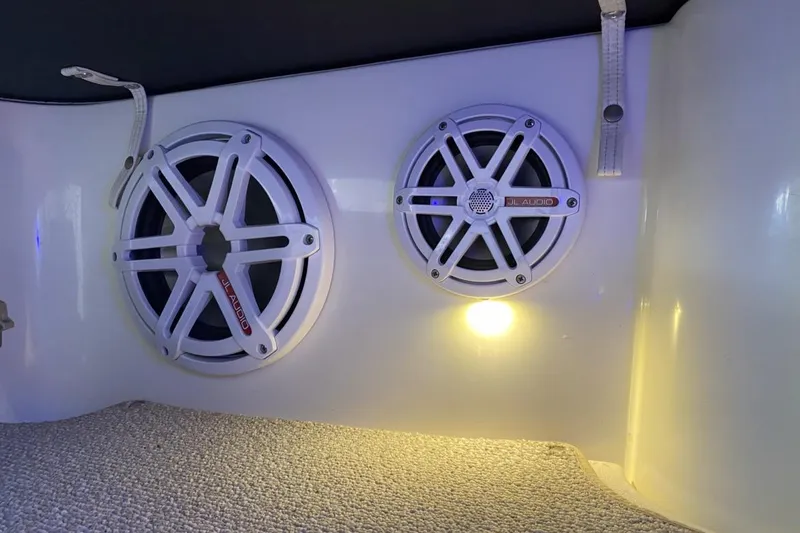 Slide: The Image of JL Audio speakers in a 2004 Larson Cabrio 330 boat interior. - 14