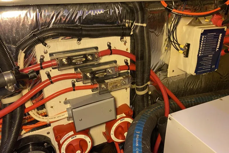 Slide: The Image of Engine compartment of 2004 Larson Cabrio 330 with electrical wiring and components. - 17