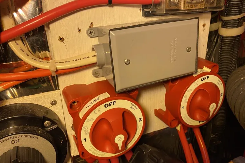 Slide: The Image of Electrical panel with switches in a 2004 Larson Cabrio 330 boat. - 18