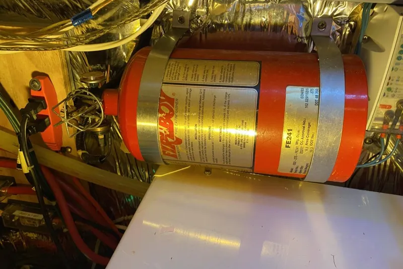 Slide: The Image of Engine room of 2004 Larson Cabrio 330 with mounted fire extinguisher. - 19