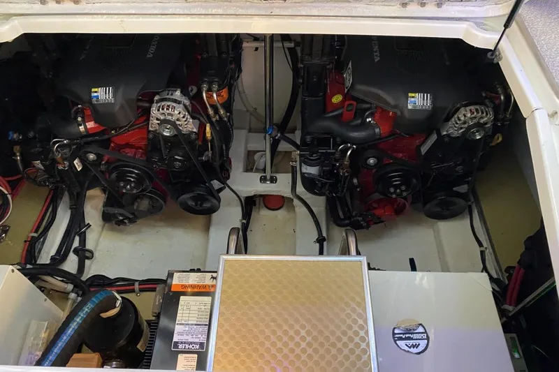 Slide: The Image of Engine compartment of a 2004 Larson Cabrio 330 boat with dual Volvo engines. - 21