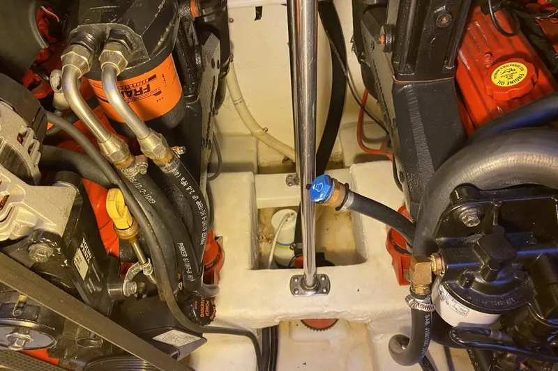 Slide: The Image of Engine compartment of a 2004 Larson Cabrio 330 boat, featuring detailed mechanical components. - 29