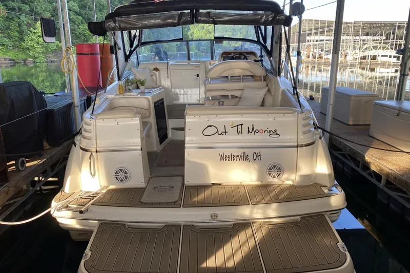 Slide: The Image of 2004 Larson Cabrio 330 boat docked, named "Out Til Mooring," in Westerville, OH. - 3