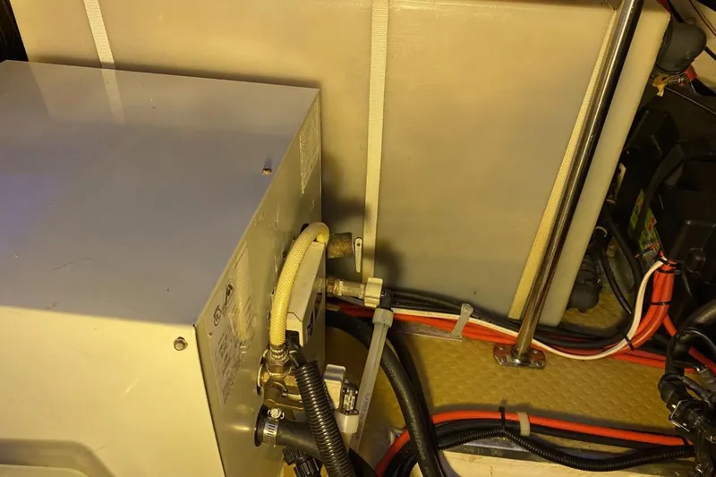 Slide: The Image of Engine compartment of a 2004 Larson Cabrio 330 boat, showing wiring and components. - 30