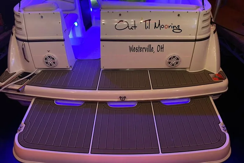Slide: The Image of 2004 Larson Cabrio 330 boat with illuminated deck, named "Out Til Mooring," Westerville, OH. - 31