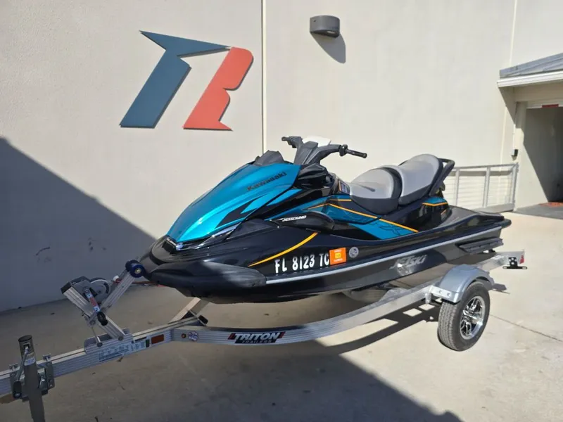 Slide: The Image of 2022 Kawasaki STX®160LX jet ski on trailer outside building. - 4
