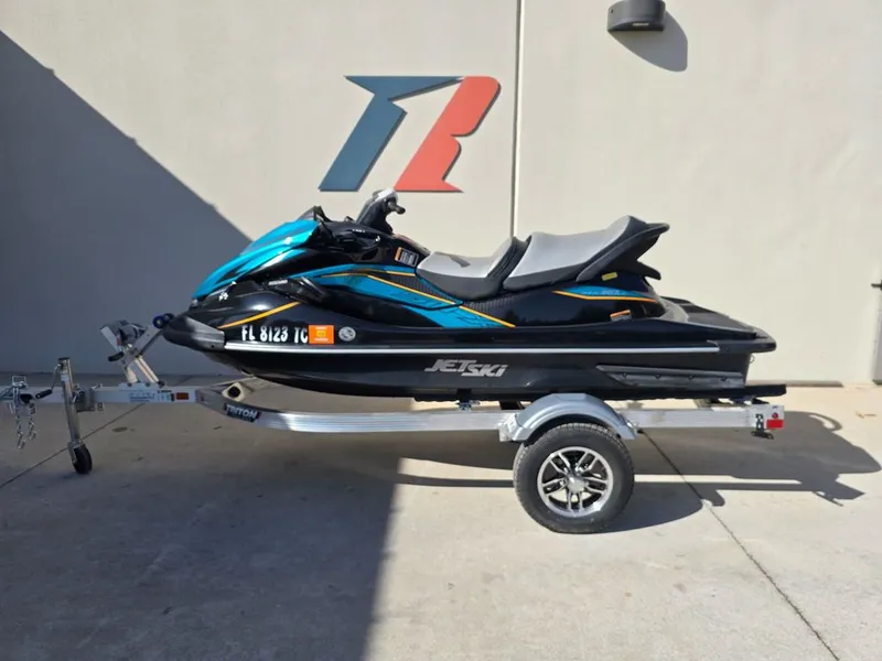 Slide: The Image of 2022 Kawasaki STX®160LX jet ski on trailer, side view. - 5
