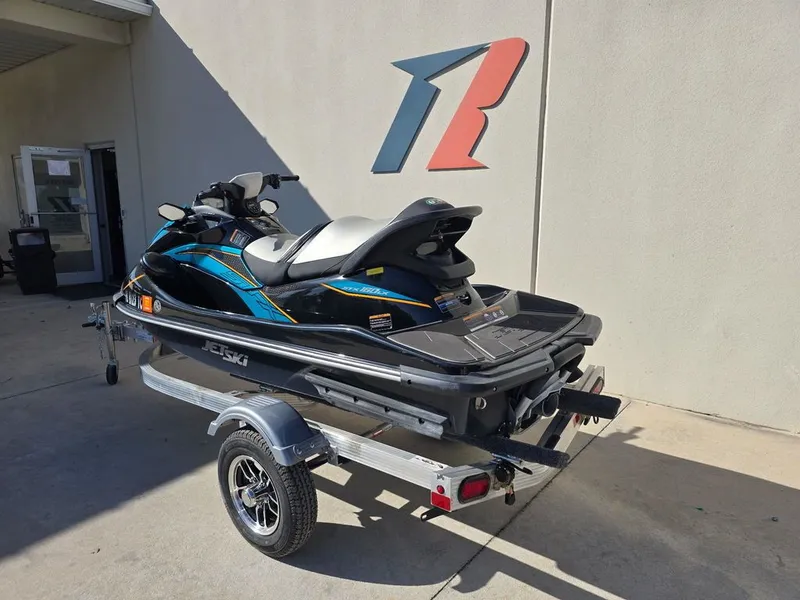 Slide: The Image of 2022 Kawasaki STX®160LX Jetski on trailer, side view. - 6