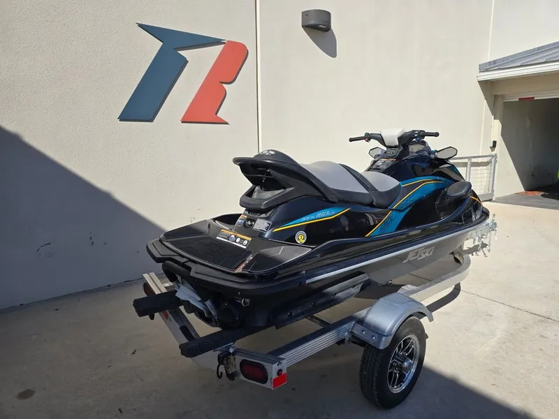 Slide: The Image of 2022 Kawasaki STX®160LX jet ski on trailer, side view. - 8