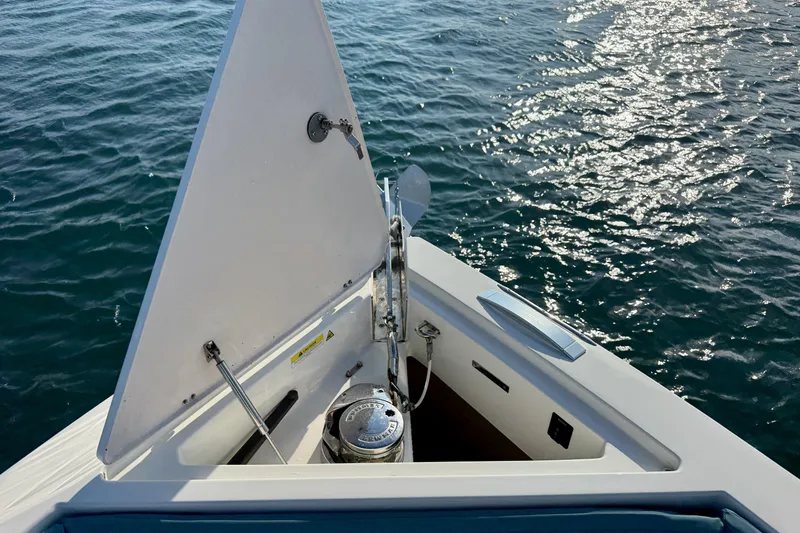 Slide: The Image of Bow of 2022 De Antonio Yachts 42, featuring anchor storage, on calm water. - 10