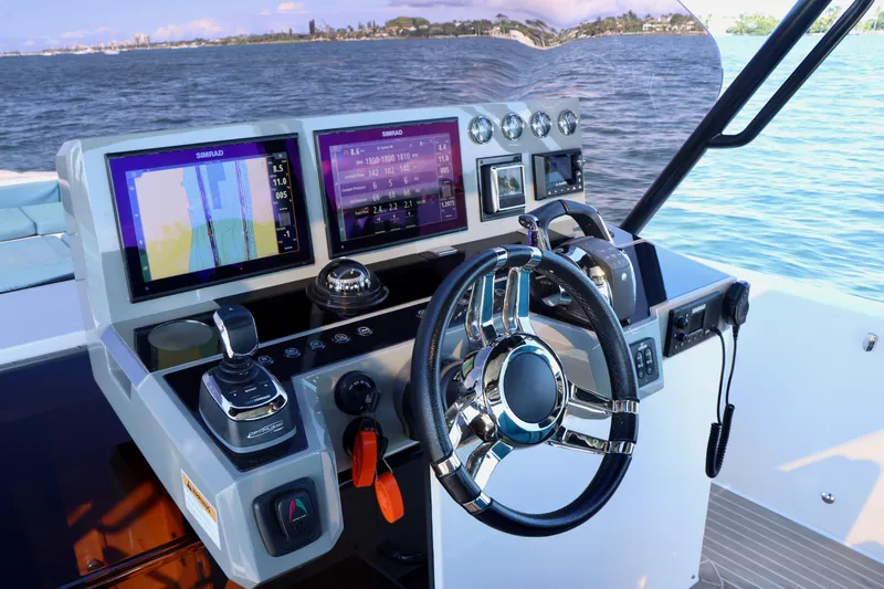 Slide: The Image of Helm of 2022 De Antonio Yachts 42 with advanced navigation displays and controls. - 17
