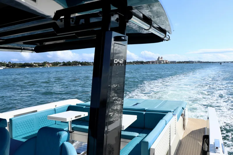 Slide: The Image of 2022 De Antonio Yachts 42 cruising on open water, featuring luxurious seating and sleek design. - 24