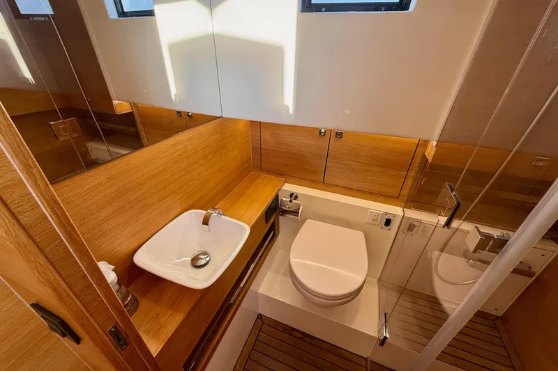 Slide: The Image of Luxurious bathroom in 2022 De Antonio Yachts 42, featuring modern fixtures and wooden accents. - 30