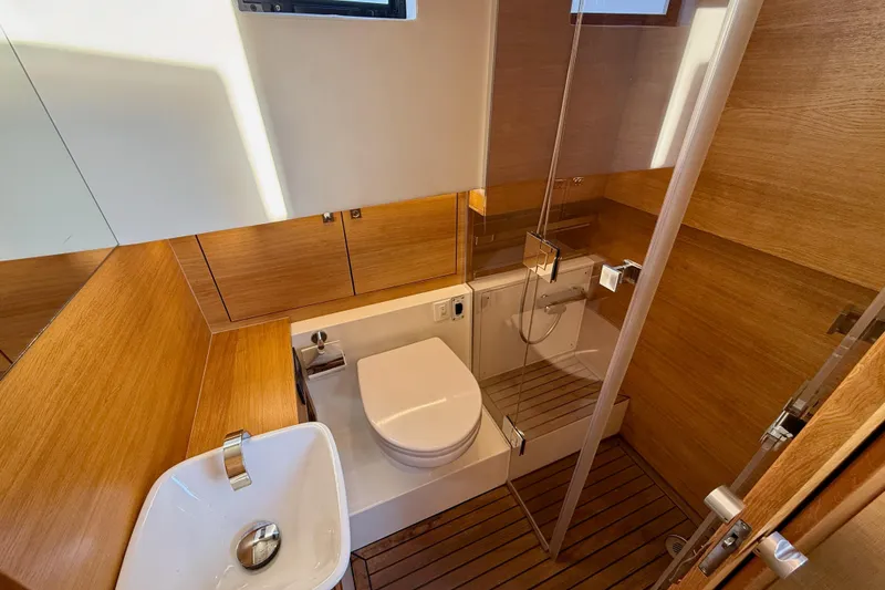 Slide: The Image of Luxurious bathroom in 2022 De Antonio Yachts 42, featuring modern fixtures and wooden accents. - 31