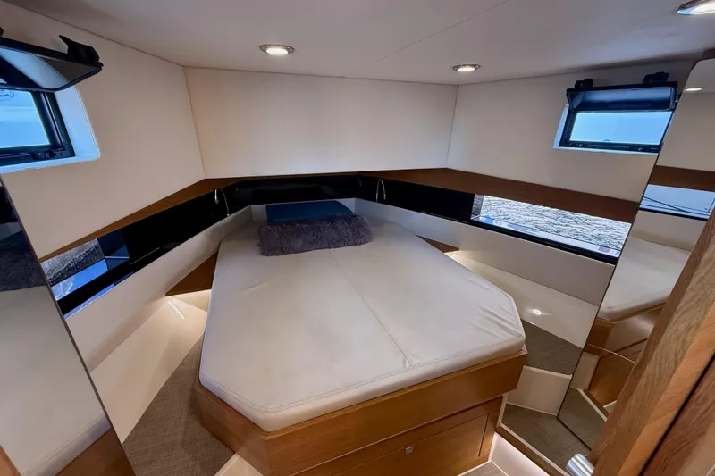 Slide: The Image of Luxurious cabin interior of 2022 De Antonio Yachts 42, featuring modern design and cozy bedding. - 33