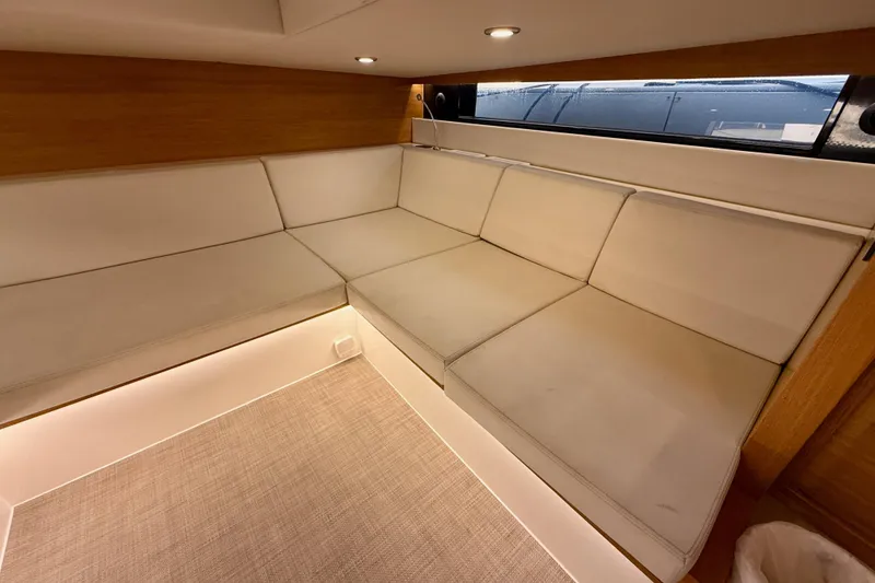 Slide: The Image of Luxurious interior seating of 2022 De Antonio Yachts 42, featuring elegant white cushions. - 36