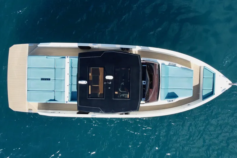 Slide: The Image of Overhead view of 2022 De Antonio Yachts 42 on blue ocean water. - 40