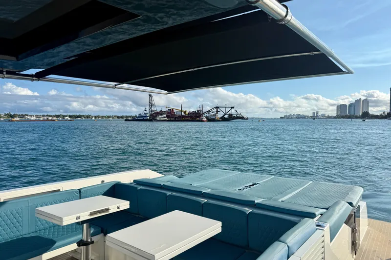 Slide: The Image of Luxurious 2022 De Antonio Yachts 42 with spacious deck, overlooking serene waterfront view. - 57