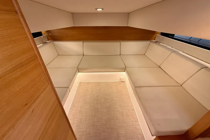 Slide: The Image of Luxurious interior of 2022 De Antonio Yachts 42 with elegant seating and wooden accents. - 68