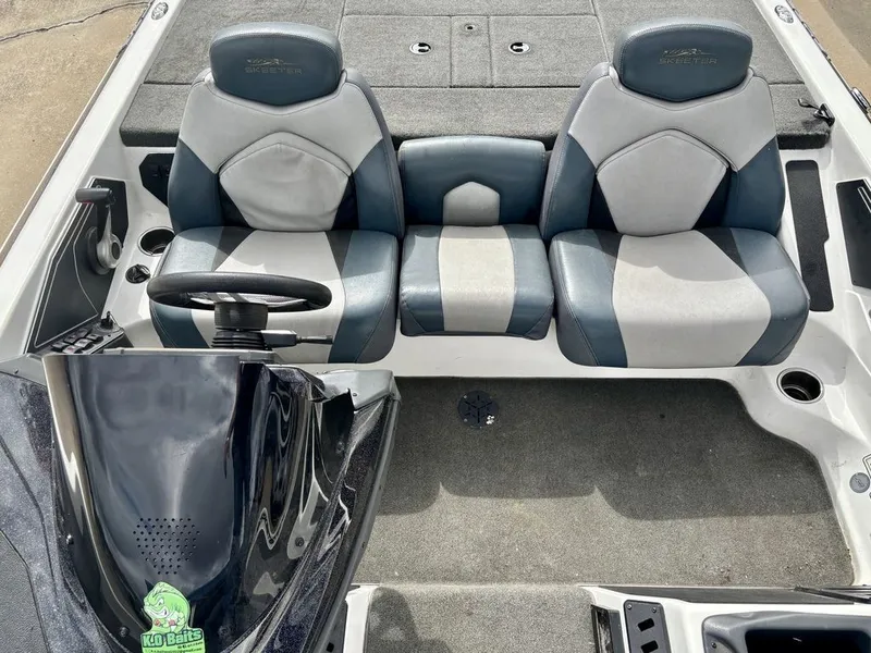 Slide: The Image of Interior of a 2016 Skeeter ZX225 boat with gray seats. - 6
