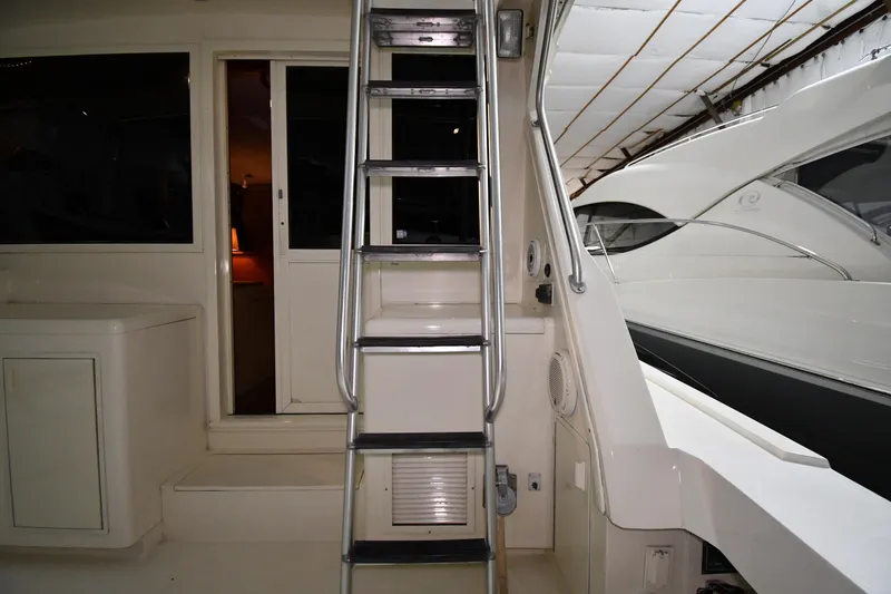 Slide: The Image of 1988 Viking 48 Convertible yacht interior with ladder and cabin entrance. - 18