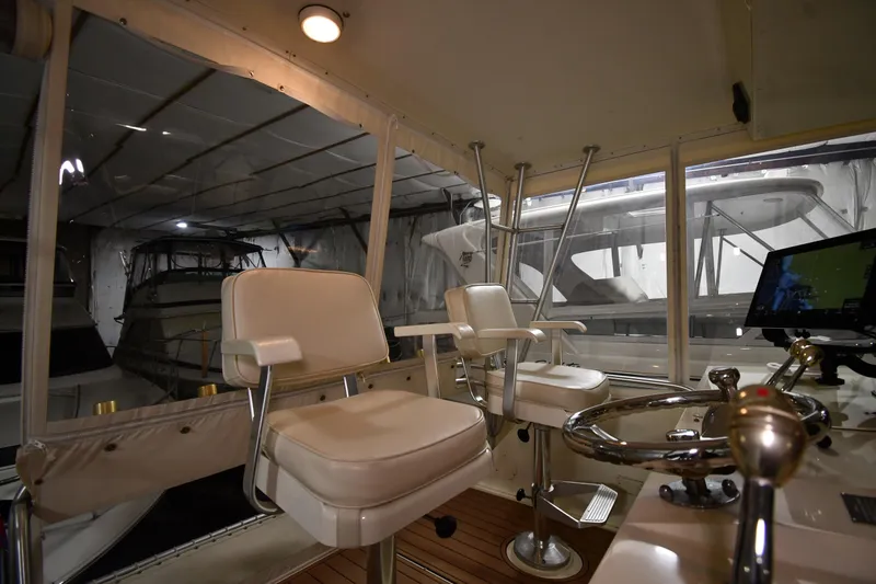 Slide: The Image of Interior of 1988 Viking 48 Convertible yacht with helm and seating. - 29