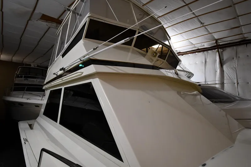 Slide: The Image of 1988 Viking 48 Convertible yacht in indoor storage, showcasing sleek design and structure. - 3