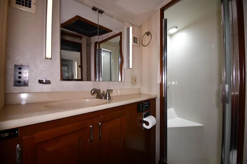 Slide: The Image of Bathroom interior of 1988 Viking 48 Convertible yacht with sink and shower. - 38
