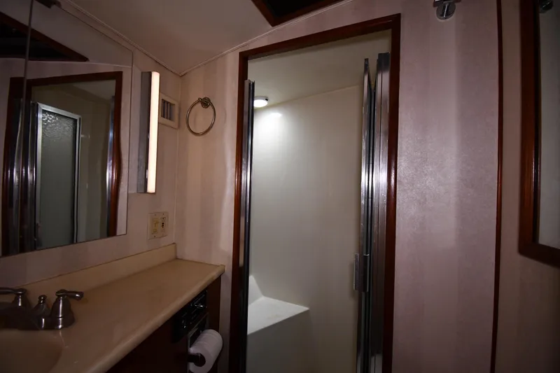 Slide: The Image of Bathroom interior of 1988 Viking 48 Convertible yacht with shower and vanity. - 39