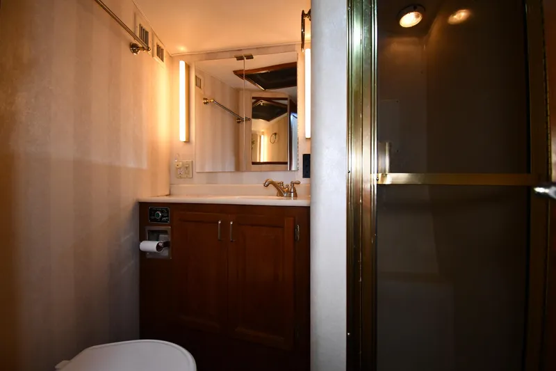 Slide: The Image of Bathroom interior of 1988 Viking 48 Convertible yacht with shower and vanity. - 41