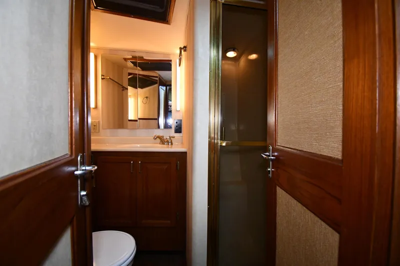 Slide: The Image of Bathroom interior of 1988 Viking 48 Convertible yacht with wooden cabinetry and shower. - 42