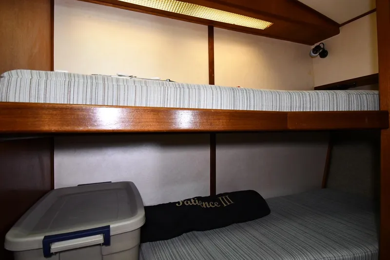 Slide: The Image of Bunk beds in 1988 Viking 48 Convertible yacht cabin with storage container. - 46