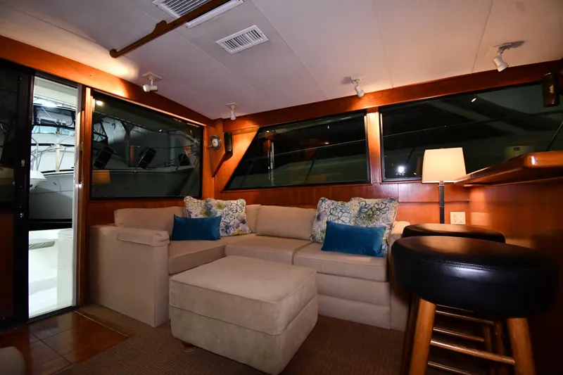 Slide: The Image of Luxurious interior of 1988 Viking 48 Convertible yacht with cozy seating and elegant decor. - 51