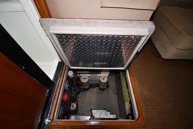 Slide: The Image of Engine compartment of a 1988 Viking 48 Convertible yacht with diamond plate hatch. - 68