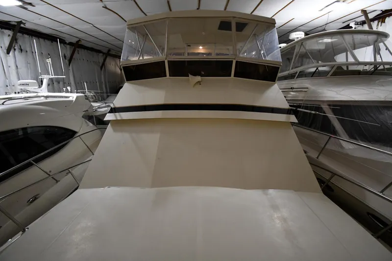 Slide: The Image of Viking 48 Convertible 1988 in storage facility, front view. - 7