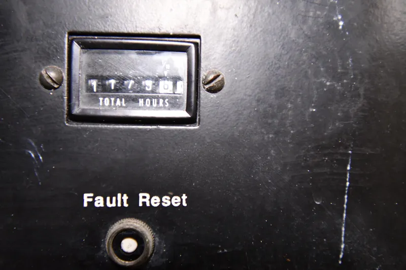 Slide: The Image of Hour meter and fault reset button on 1988 Viking 48 Convertible. - 73