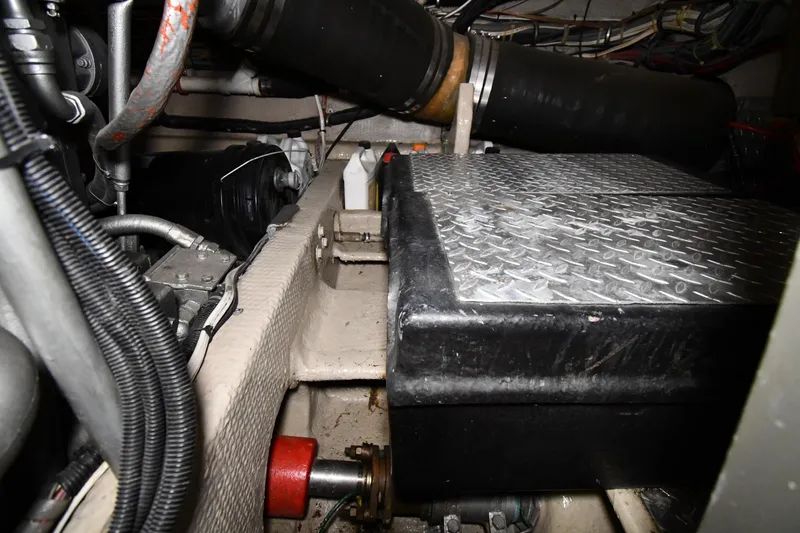Slide: The Image of Engine room of 1988 Viking 48 Convertible yacht, showing mechanical components and wiring. - 75