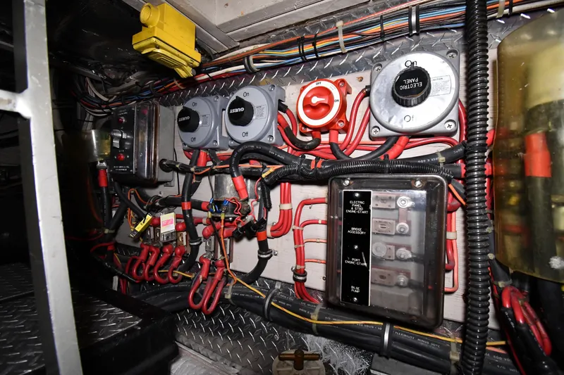 Slide: The Image of Electrical panel and wiring inside a 1988 Viking 48 Convertible boat. - 76