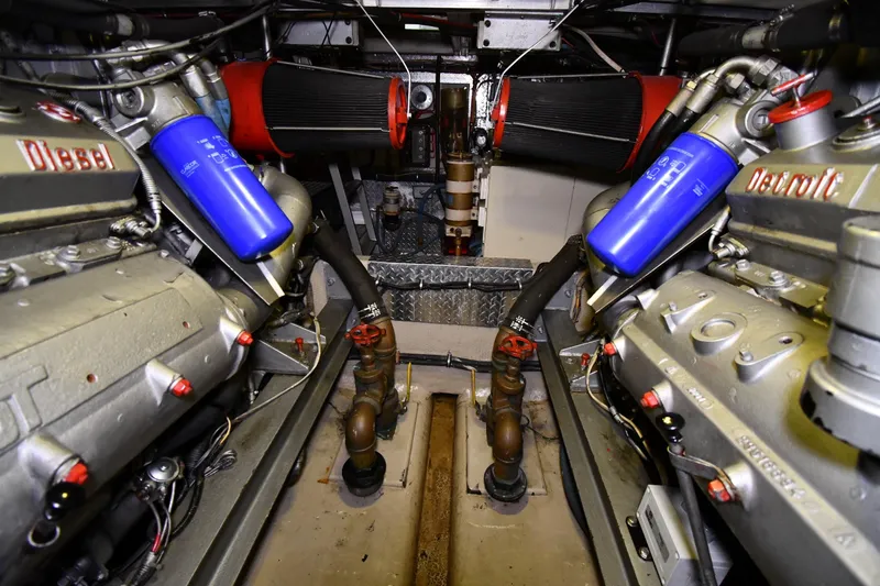 Slide: The Image of Engine room of 1988 Viking 48 Convertible with Detroit Diesel engines and blue filters. - 81
