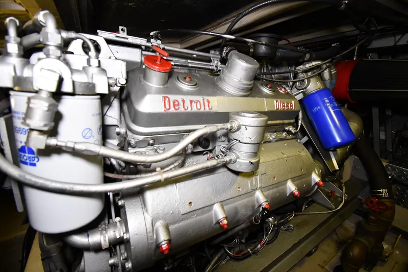 Slide: The Image of Engine of a 1988 Viking 48 Convertible boat, featuring a Detroit Diesel engine. - 83