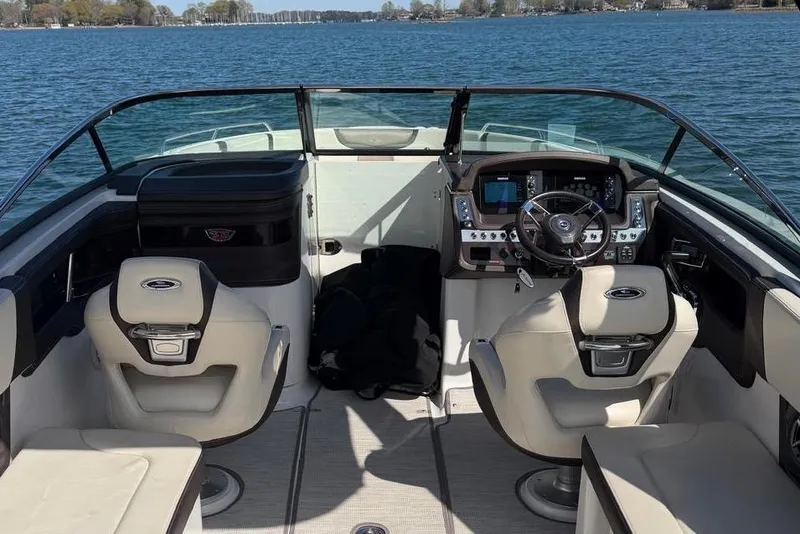 Slide: The Image of Interior of a 2018 Chaparral 267 SSX boat on the water. - 11