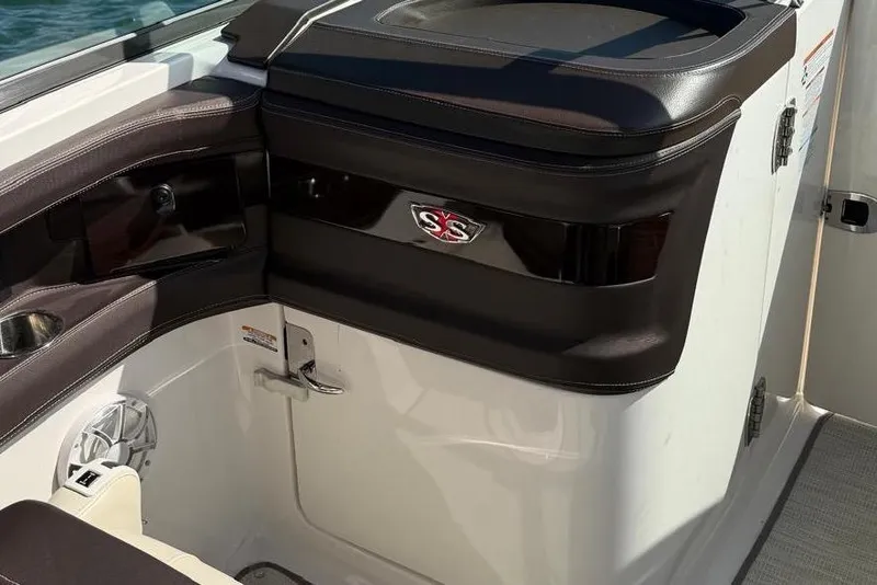 Slide: The Image of 2018 Chaparral 267 SSX boat interior with sleek black and white design. - 12